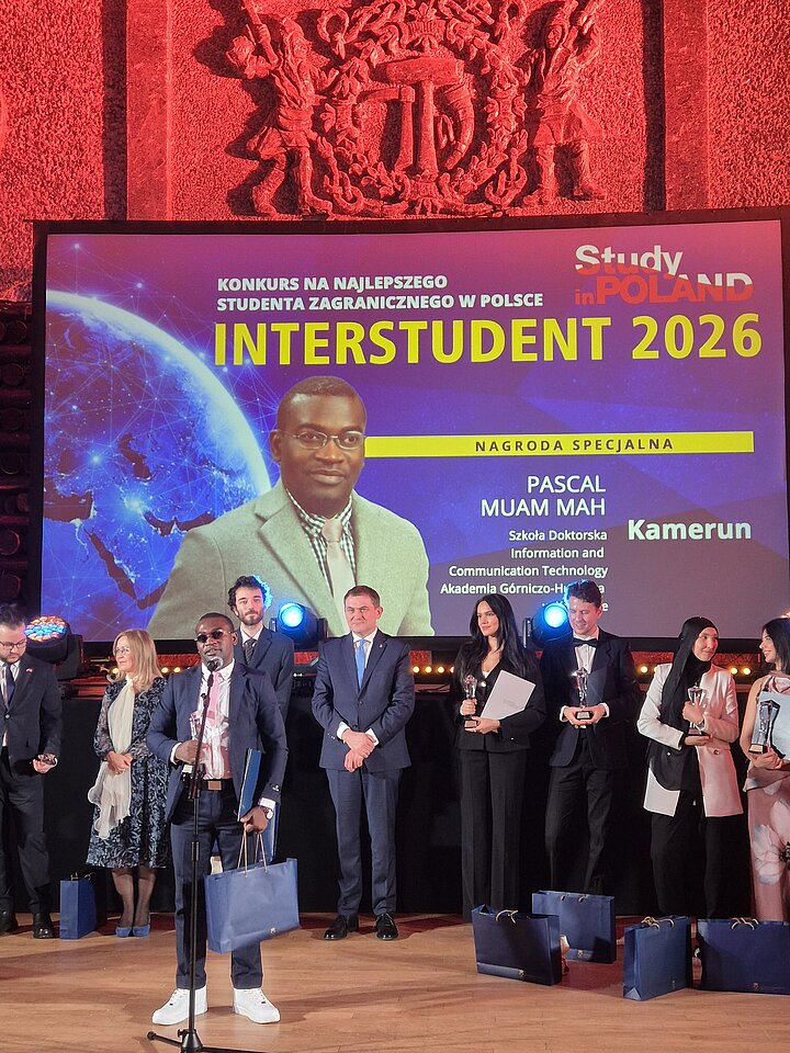 A group of people standing on stage during an awards ceremony